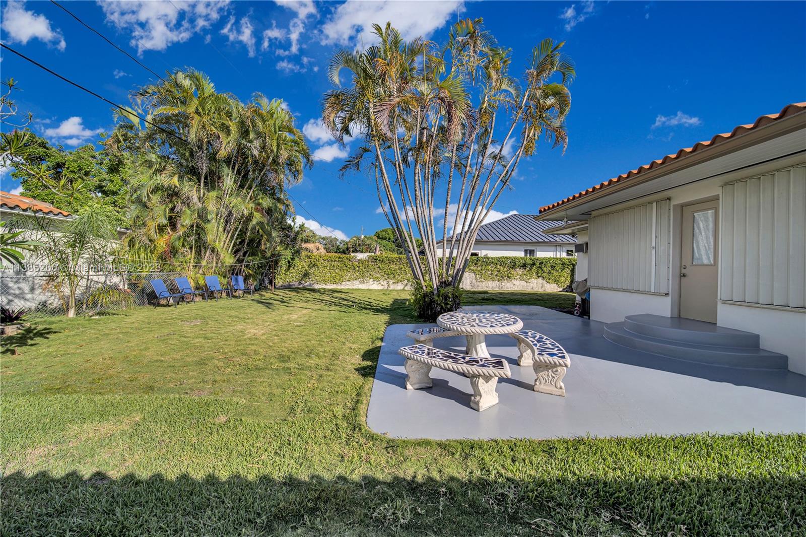 615 Southwest 21st Road Miami, FL 33129 - Photo 17 of 43 a view of a house with a yard