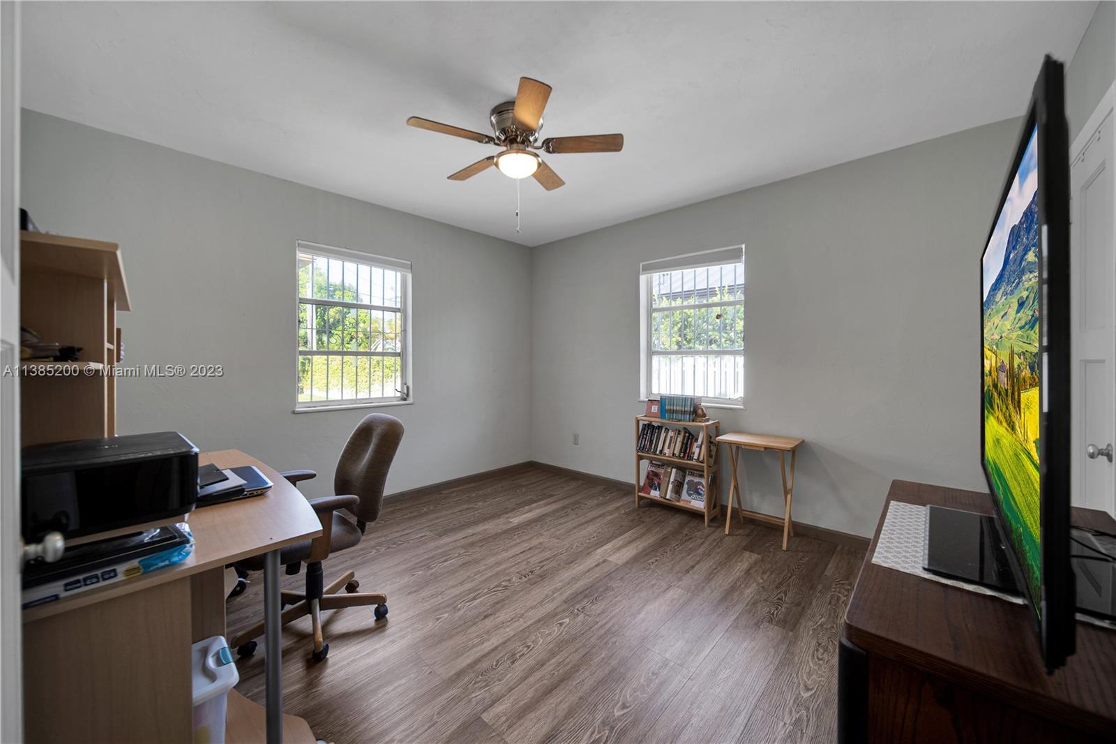 615 Southwest 21st Road Miami, FL 33129 - Photo 18 of 43 a view of a workspace with furniture and a window