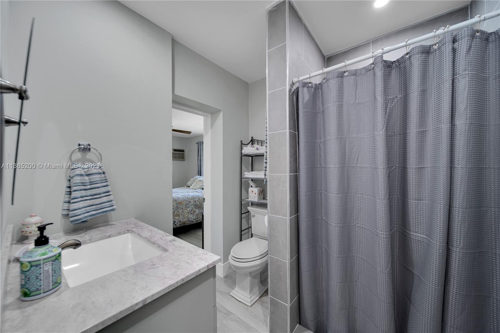 615 Southwest 21st Road Miami, FL 33129 - Photo 22 of 43 a bathroom with a granite countertop sink toilet and shower