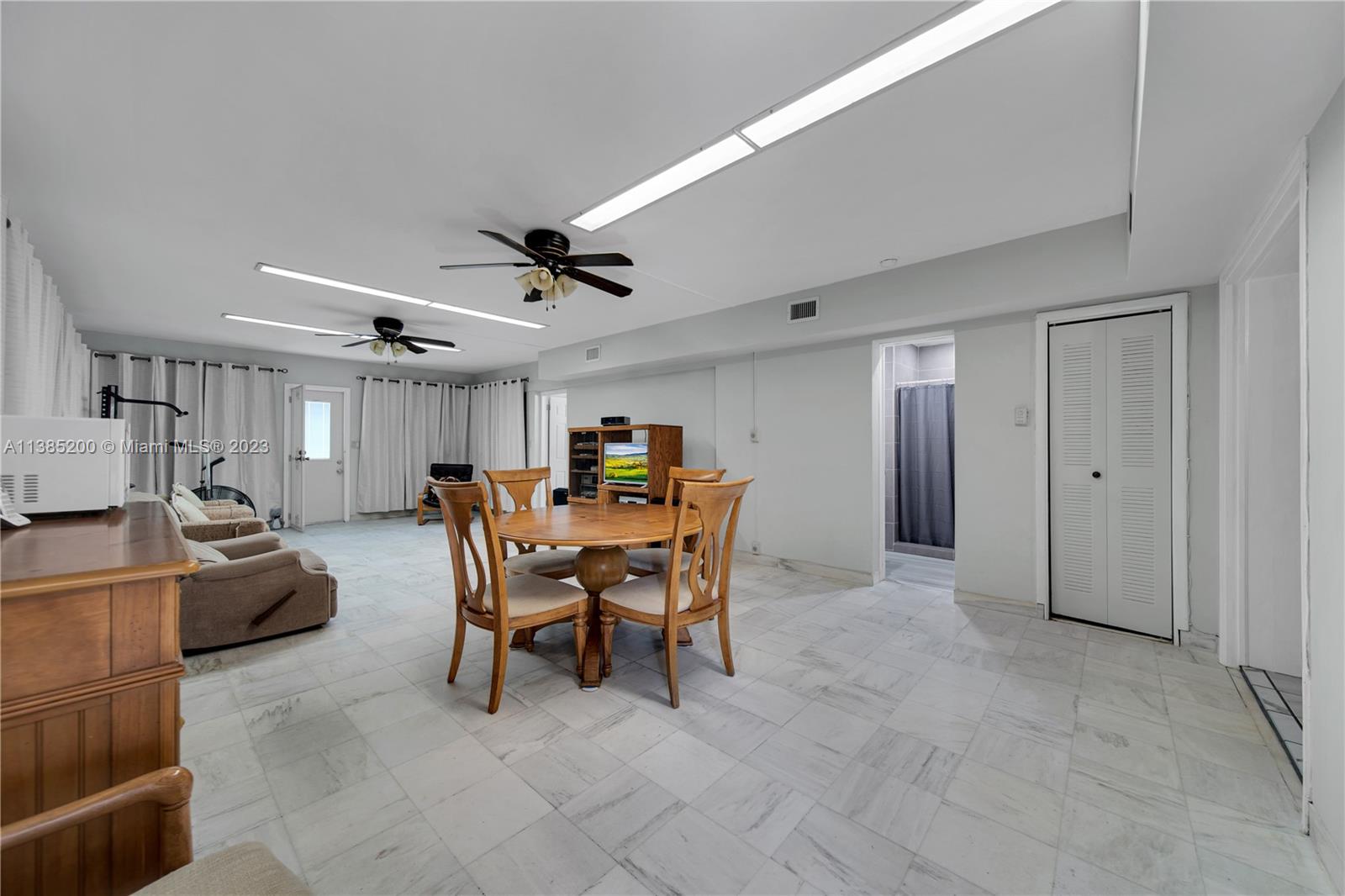 615 Southwest 21st Road Miami, FL 33129 - Photo 24 of 43 a dining room with furniture and a livingroom