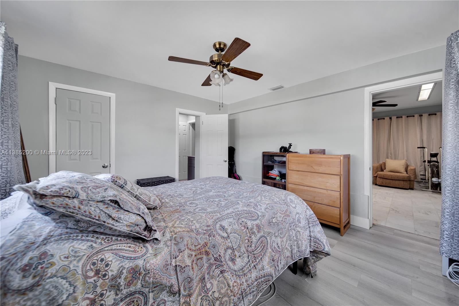 615 Southwest 21st Road Miami, FL 33129 - Photo 25 of 43 a bedroom with a bed and dresser