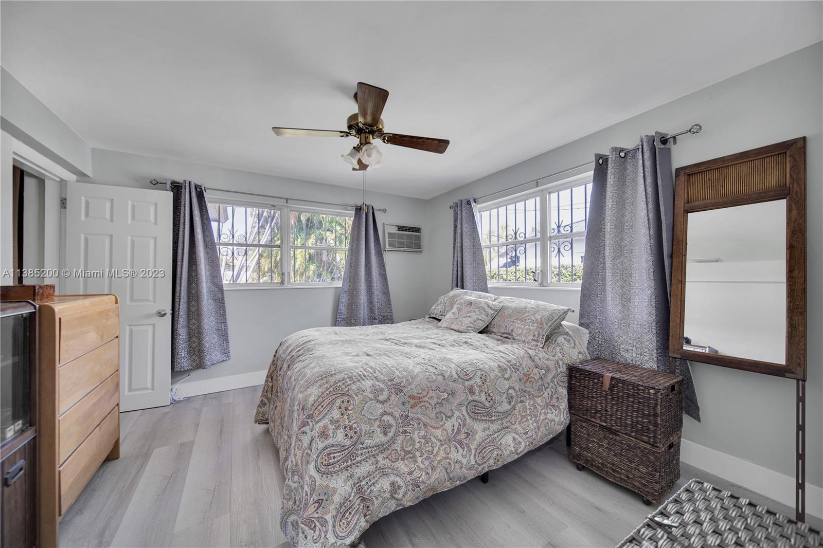 615 Southwest 21st Road Miami, FL 33129 - Photo 27 of 43 a bedroom with a large bed and a window