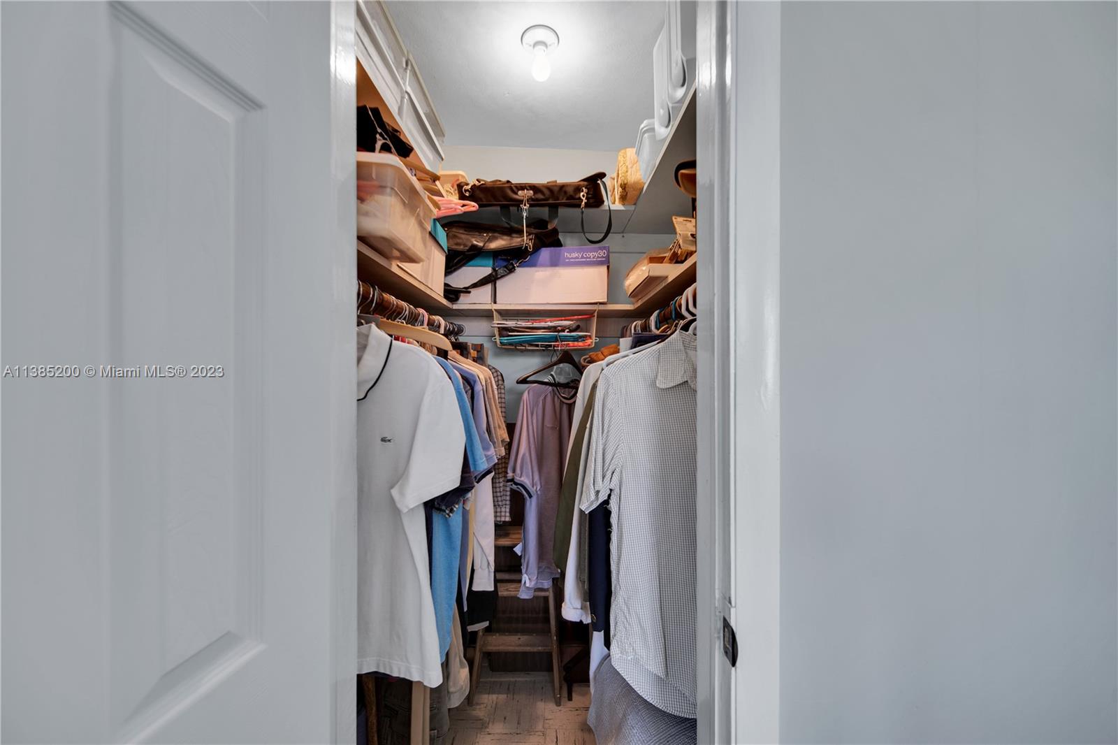 615 Southwest 21st Road Miami, FL 33129 - Photo 29 of 43 a view of walk in closet with clothes and shoes
