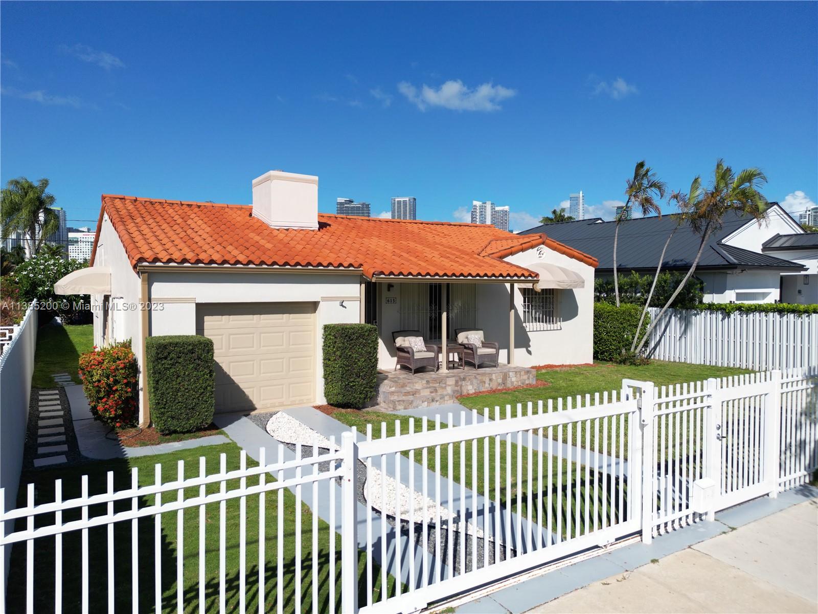 615 Southwest 21st Road Miami, FL 33129 - Photo 33 of 43 a front view of a house with a porch