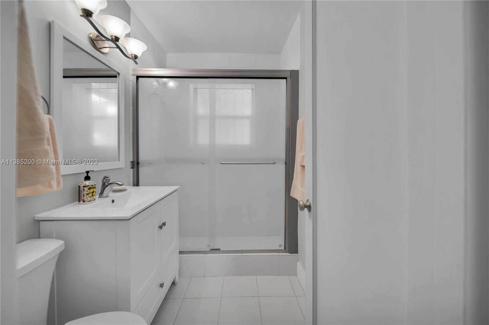 615 Southwest 21st Road Miami, FL 33129 - Photo 7 of 43 a bathroom with a sink a toilet and shower