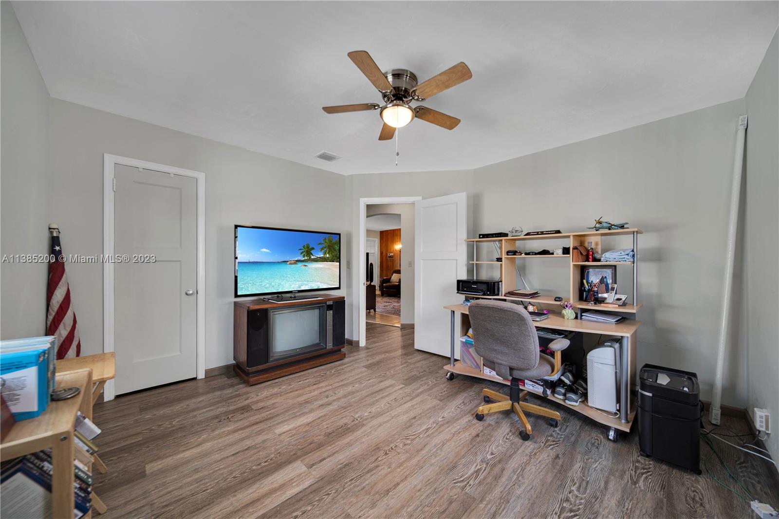 615 Southwest 21st Road Miami, FL 33129 - Photo 9 of 43 a living room with furniture and a flat screen tv