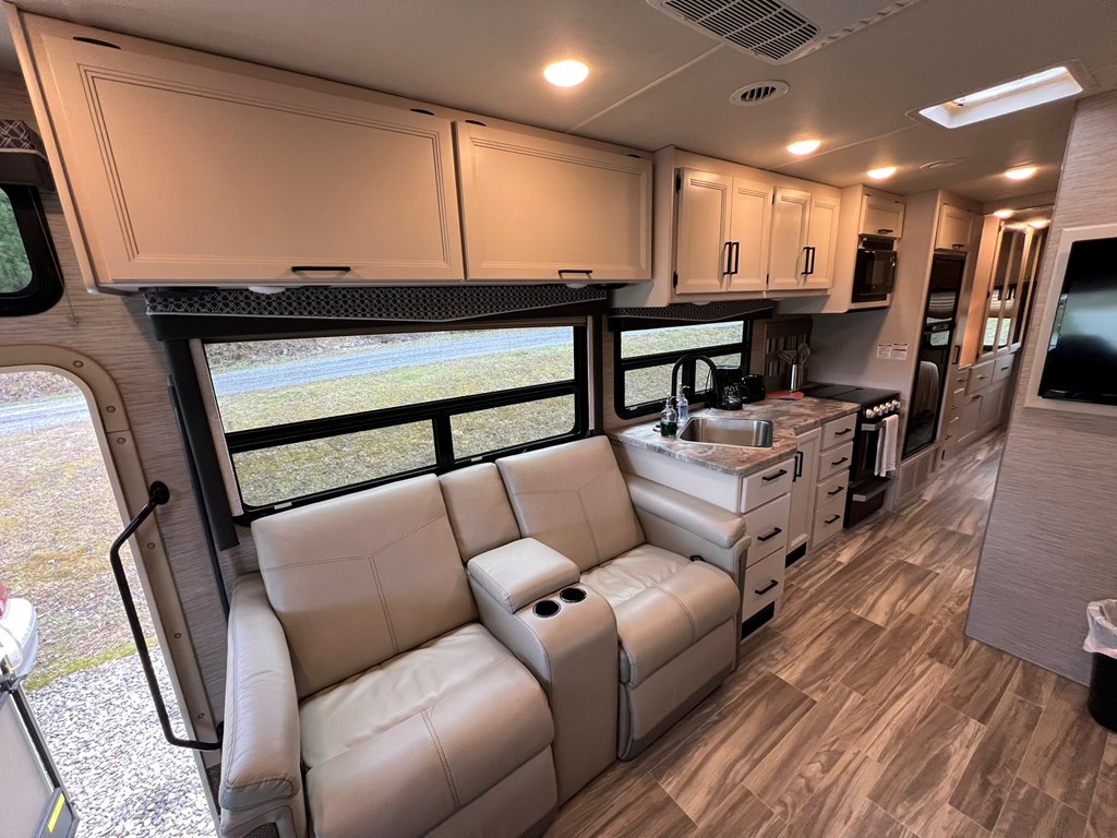 62 Waterside Blue Ridge Morganton, GA 30560 - Photo 12 of 38 a living room with furniture and a flat screen tv