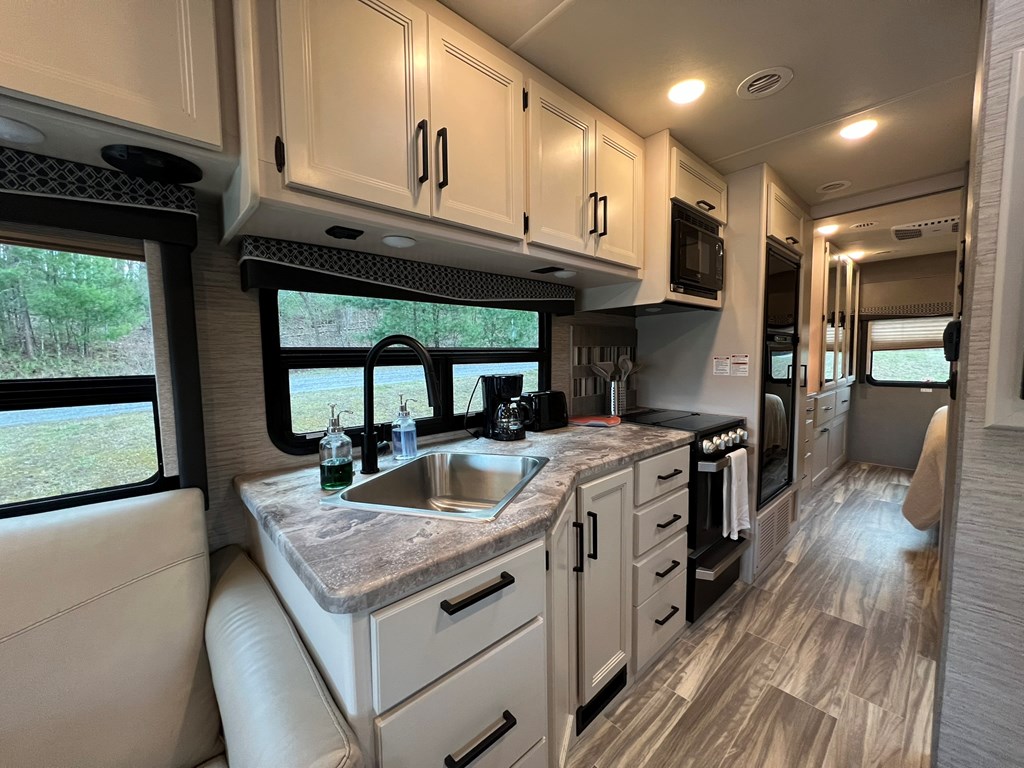 62 Waterside Blue Ridge Morganton, GA 30560 - Photo 13 of 38 a kitchen with granite countertop a stove and a sink
