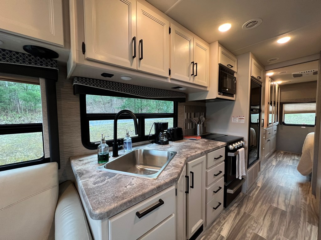 62 Waterside Blue Ridge Morganton, GA 30560 - Photo 14 of 38 a kitchen that has a sink a stove and a wooden floor