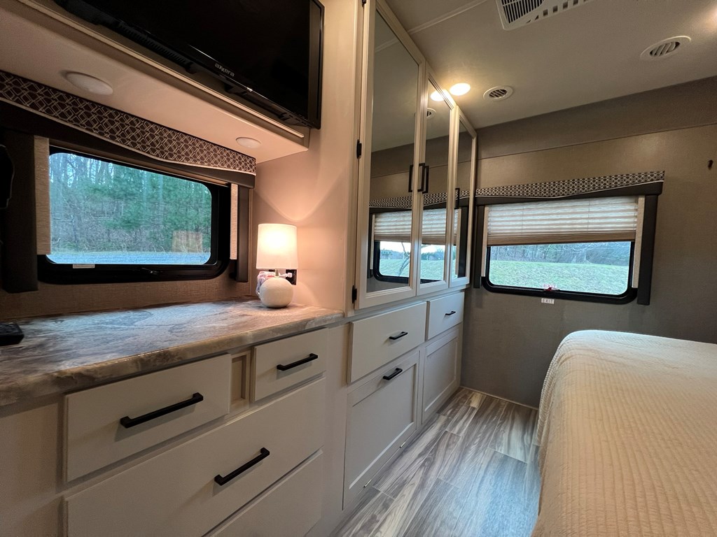 62 Waterside Blue Ridge Morganton, GA 30560 - Photo 22 of 38 a bathroom with a sink a mirror and a window