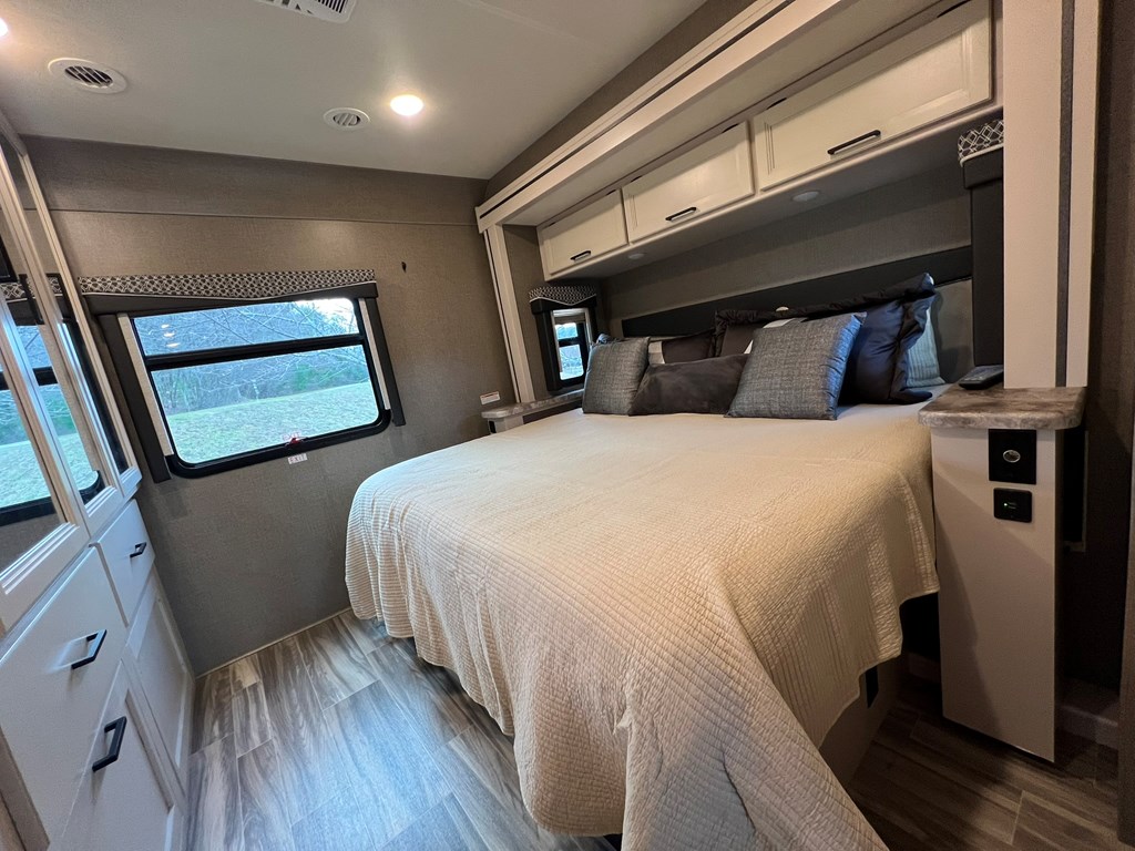 62 Waterside Blue Ridge Morganton, GA 30560 - Photo 25 of 38 a bed sitting in a bedroom next to a window