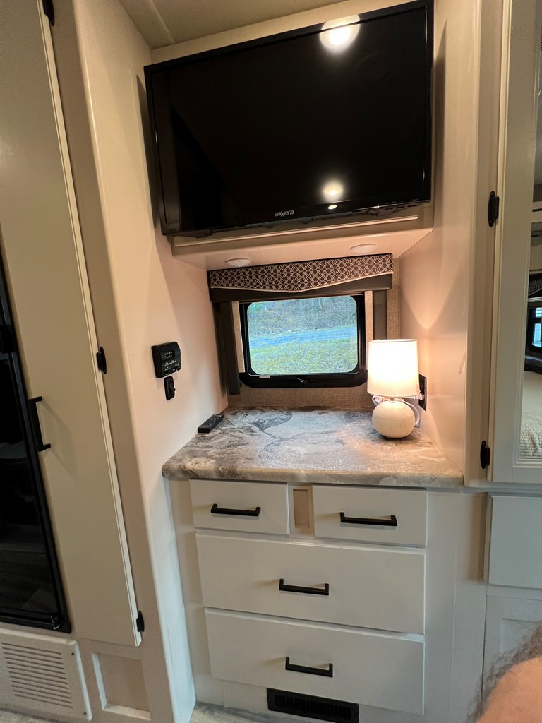 62 Waterside Blue Ridge Morganton, GA 30560 - Photo 28 of 38 a living room with a fireplace and a flat screen tv