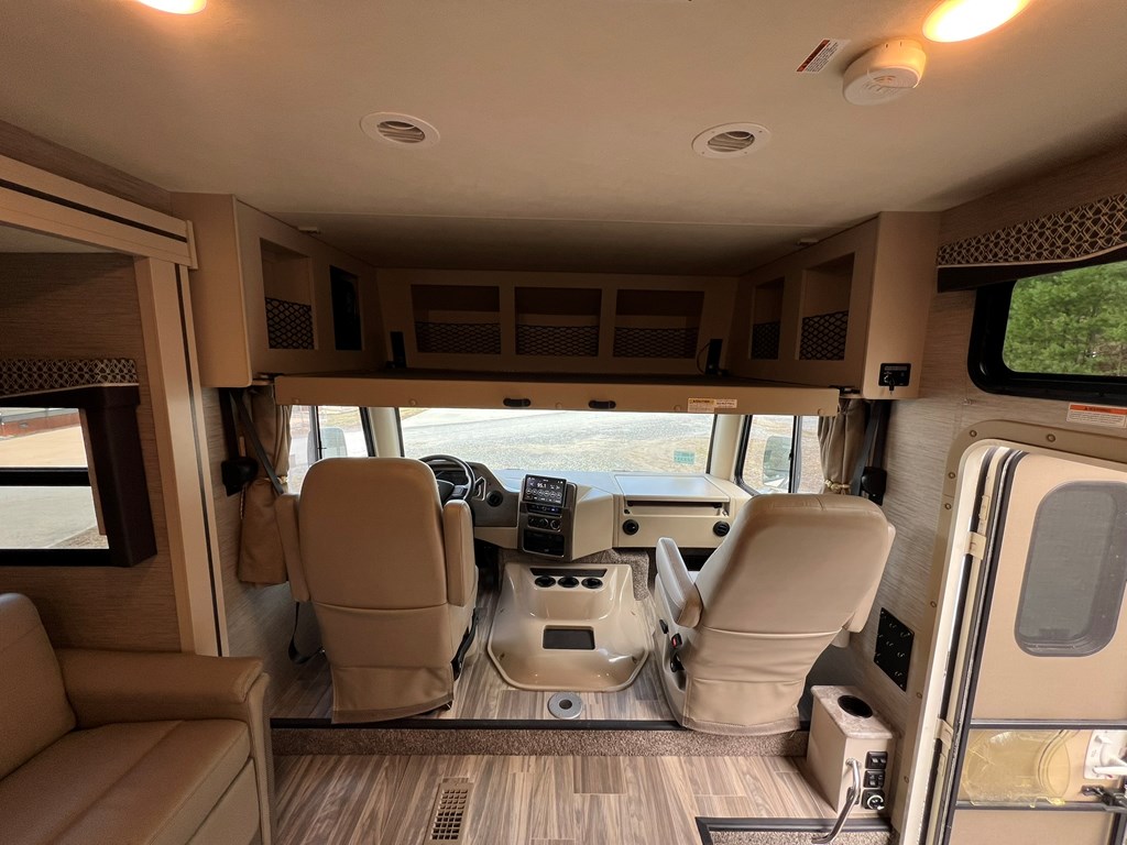 62 Waterside Blue Ridge Morganton, GA 30560 - Photo 34 of 38 a living room with furniture a flat screen tv and floor to ceiling window