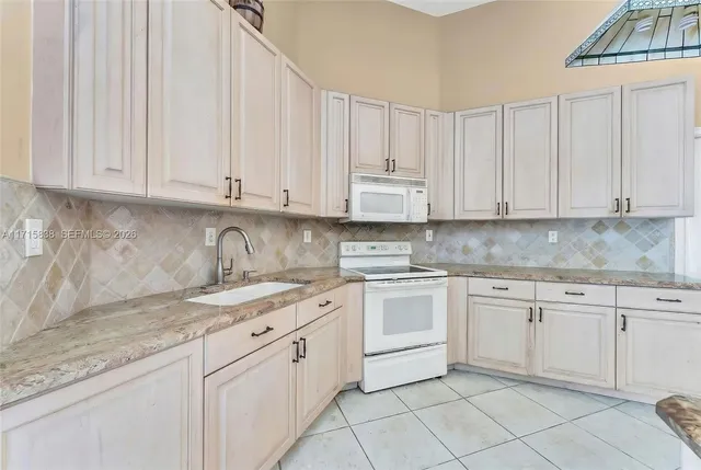 $1,120,000 | 4956 Rothschild Drive, Coral Springs, FL 33067