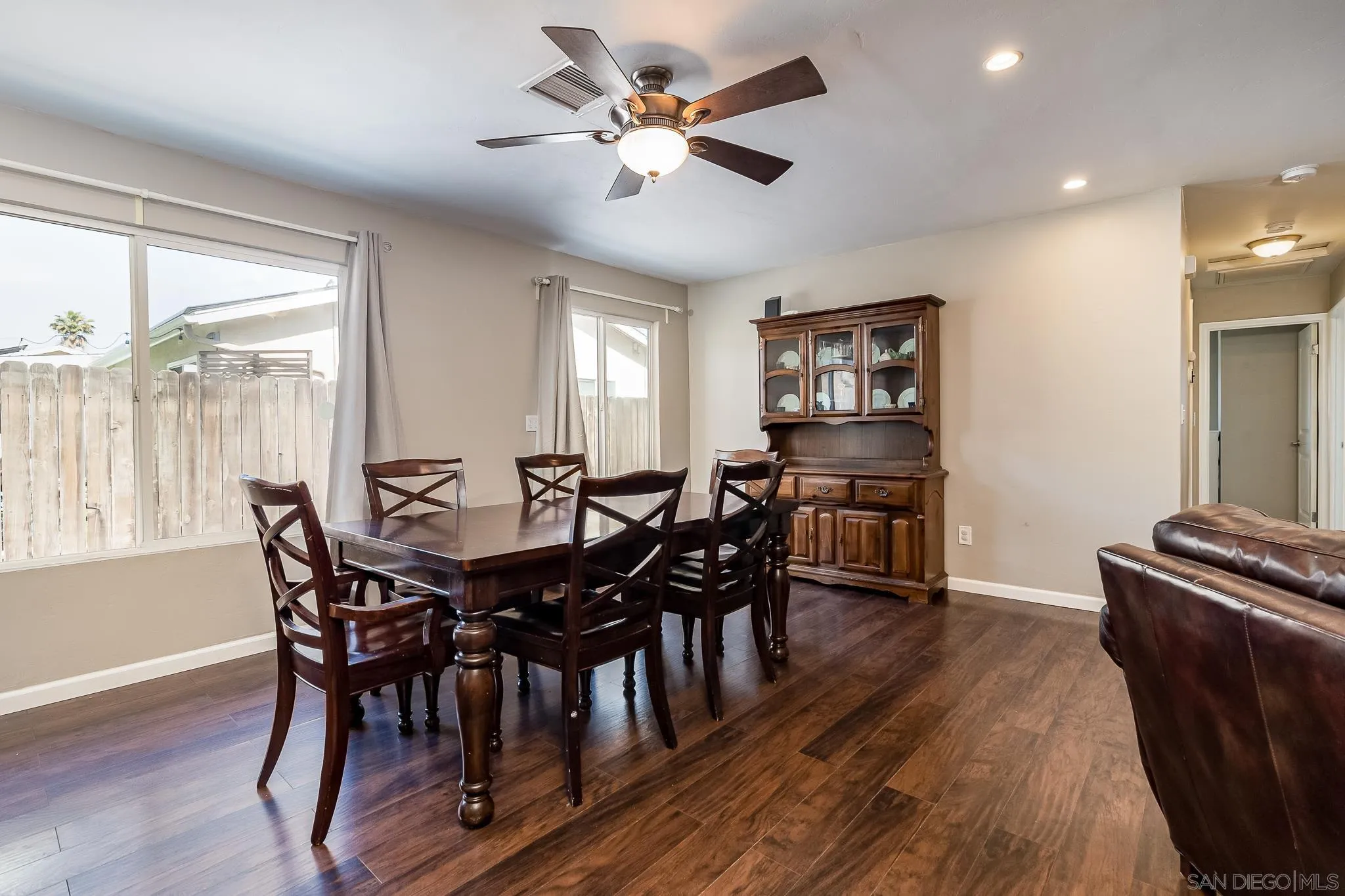 8029 Woodpecker Way Santee, CA 92071 - Photo 11 of 47 a view of a dining room with furniture window and wooden floor