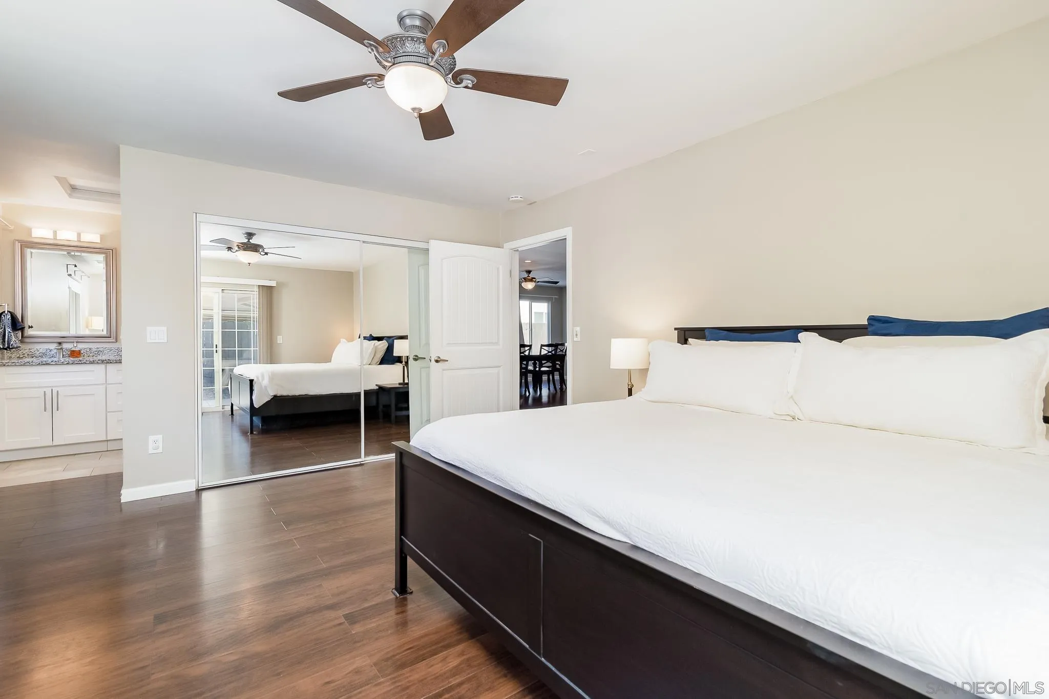8029 Woodpecker Way Santee, CA 92071 - Photo 17 of 47 a bedroom with a bed and wooden floor