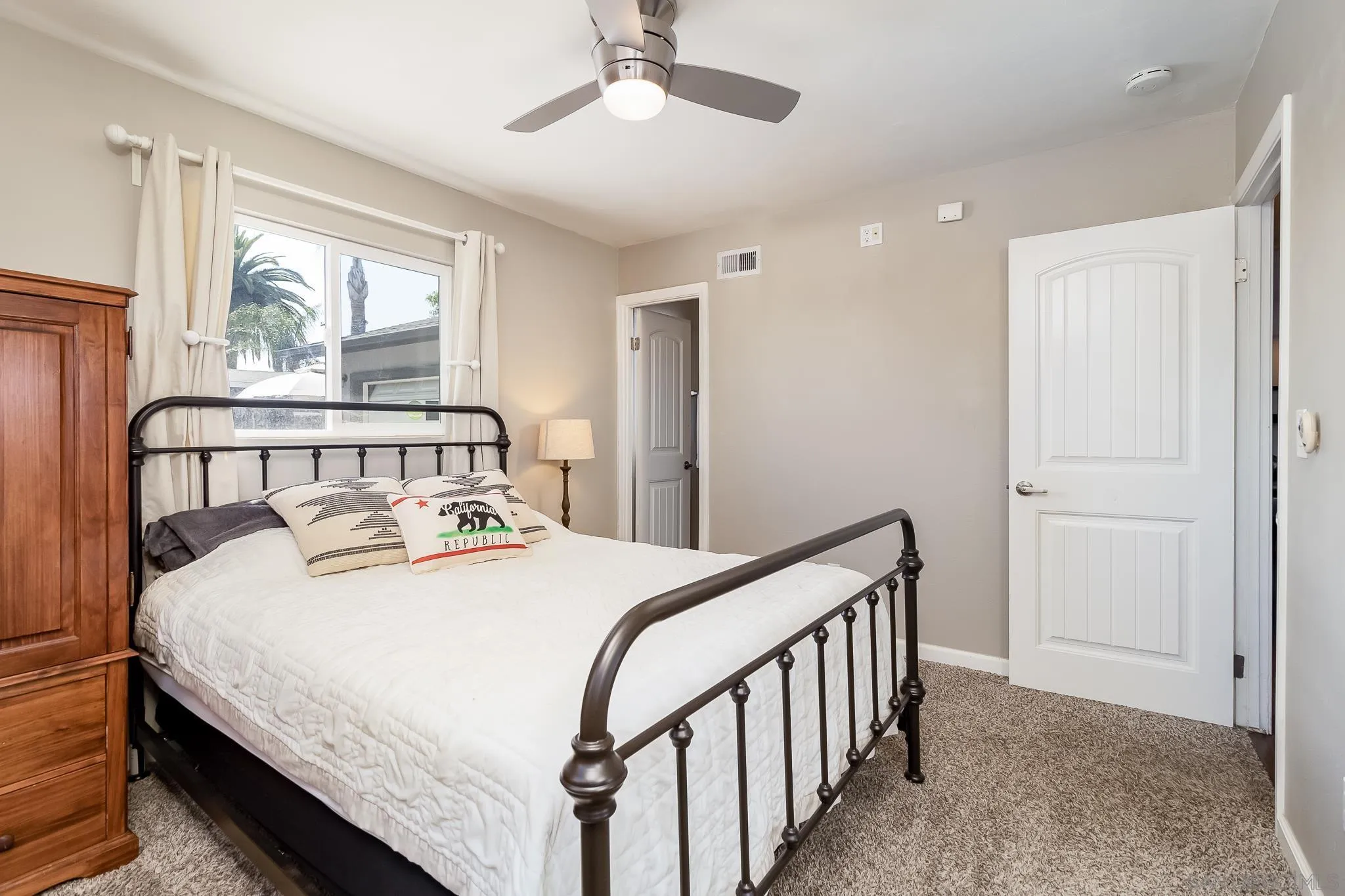 8029 Woodpecker Way Santee, CA 92071 - Photo 23 of 47 a bedroom with a bed and a large window