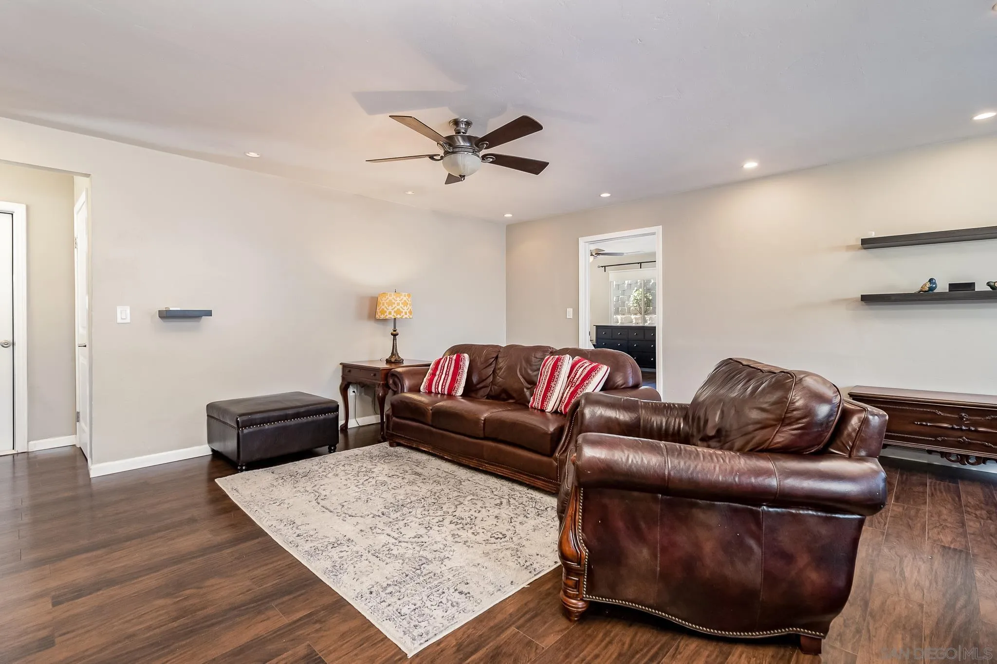 8029 Woodpecker Way Santee, CA 92071 - Photo 9 of 47 a living room with furniture and a wooden floor