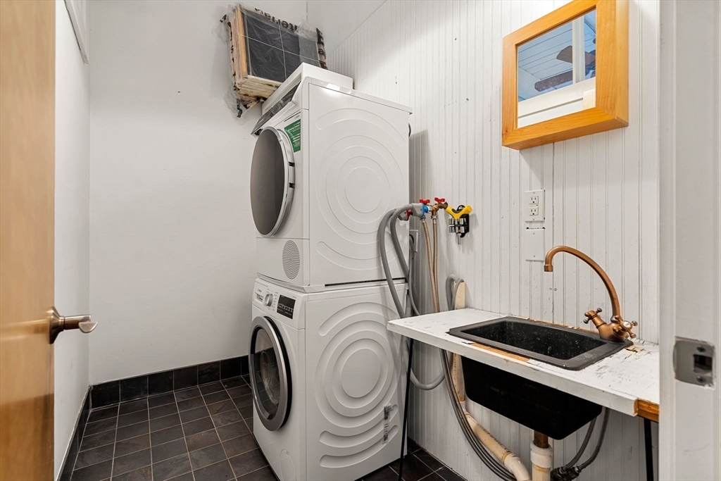 249 A Street, Unit 66 Boston, MA 02210 - Photo 22 of 26 a utility room with dryer and washer