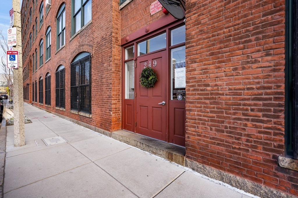 249 A Street, Unit 66 Boston, MA 02210 - Photo 24 of 26 a view of a brick buildings with entryway