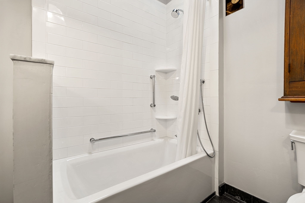 249 A Street, Unit 66 Boston, MA 02210 - Photo 9 of 26 a bathroom with a bathtub