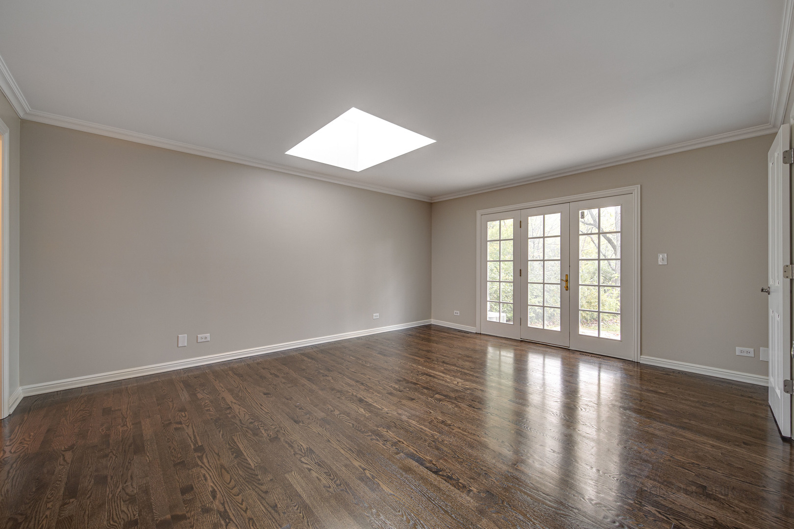 875 Valley Road Lake Forest, IL 60045 - Photo 18 of 43 a view of an empty room with wooden floor and a window