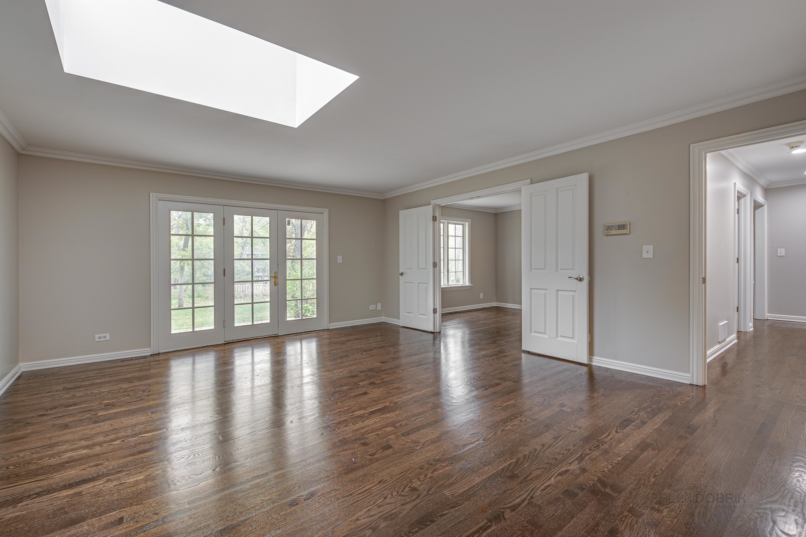 875 Valley Road Lake Forest, IL 60045 - Photo 19 of 43 a view of an empty room with wooden floor and windows