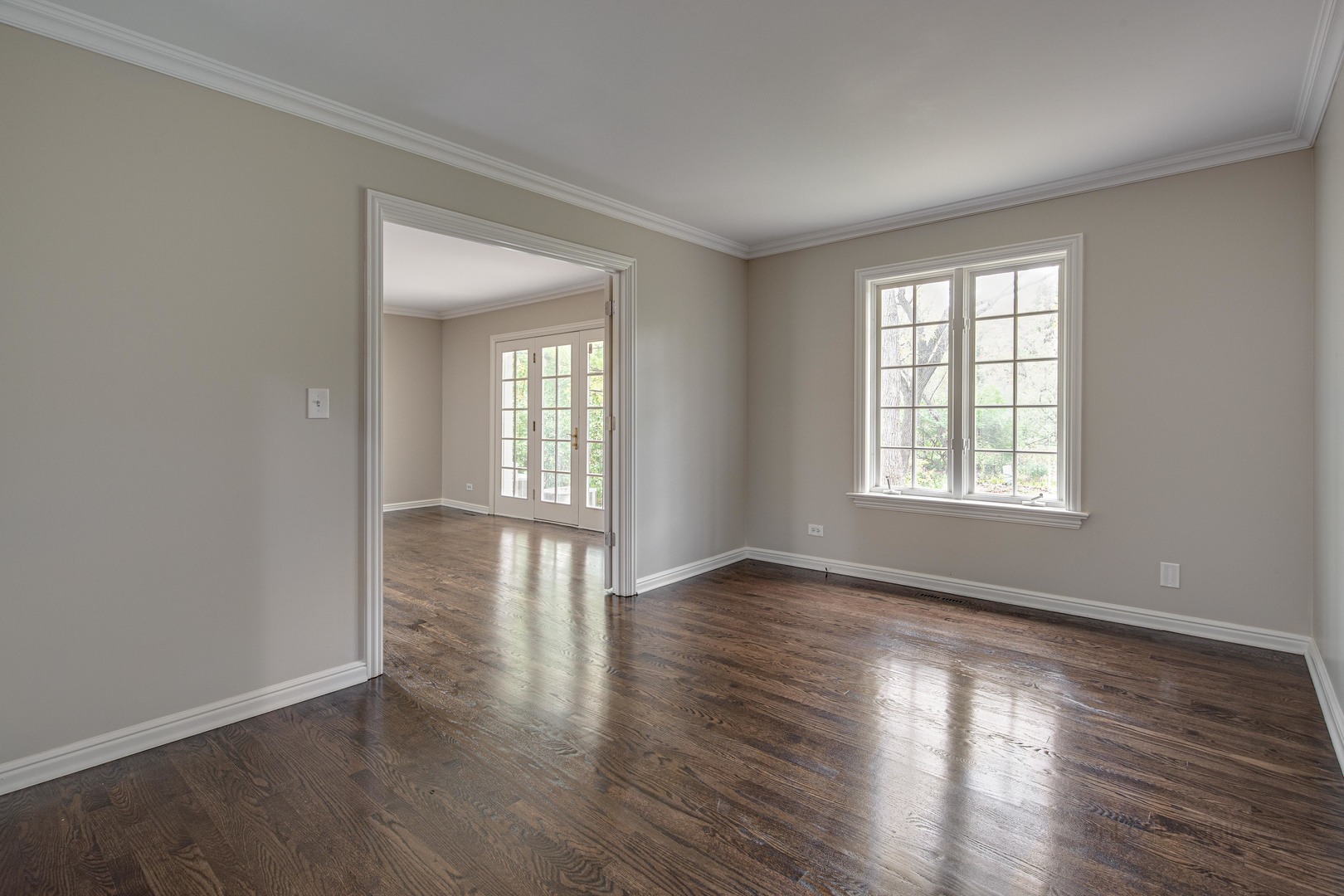 875 Valley Road Lake Forest, IL 60045 - Photo 21 of 43 a view of an empty room with wooden floor and a window