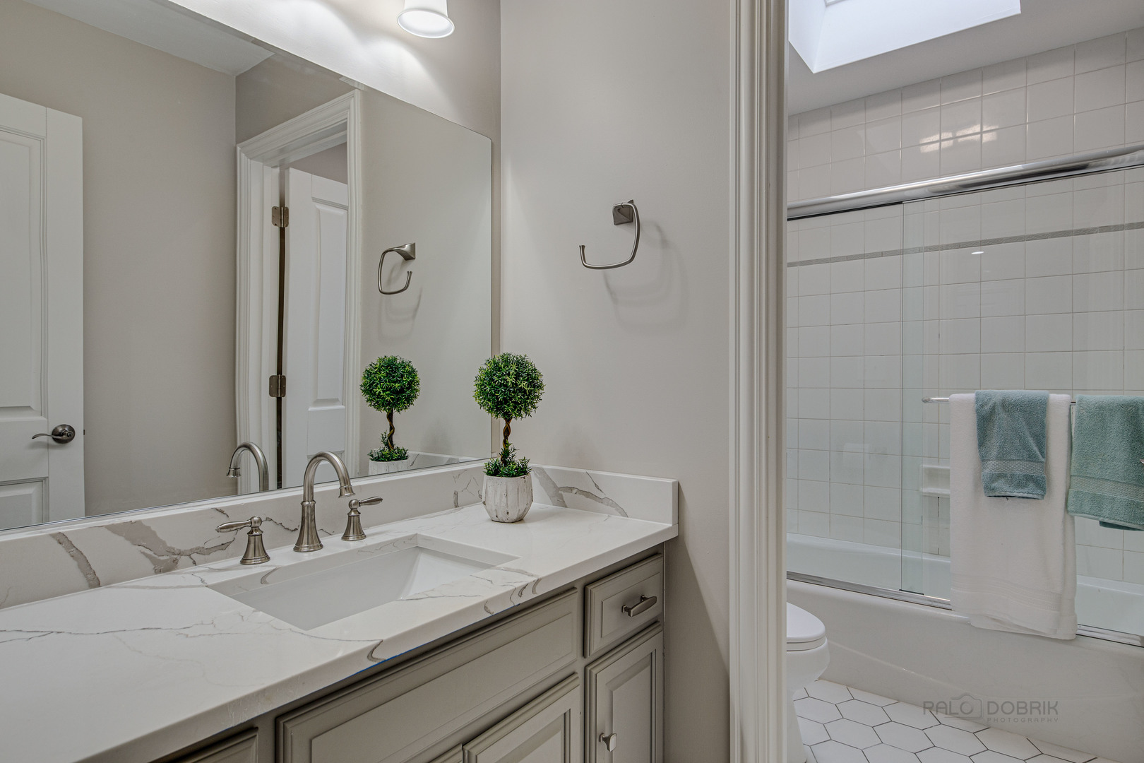 875 Valley Road Lake Forest, IL 60045 - Photo 29 of 43 a bathroom with a granite countertop sink and a mirror