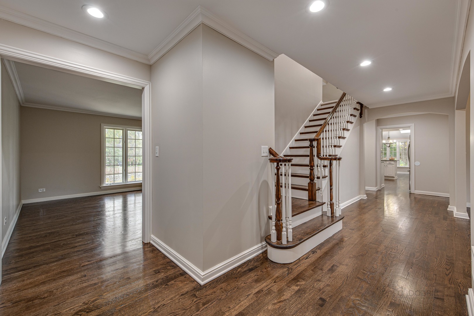 875 Valley Road Lake Forest, IL 60045 - Photo 4 of 43 a view of an empty room with wooden floor and stairs