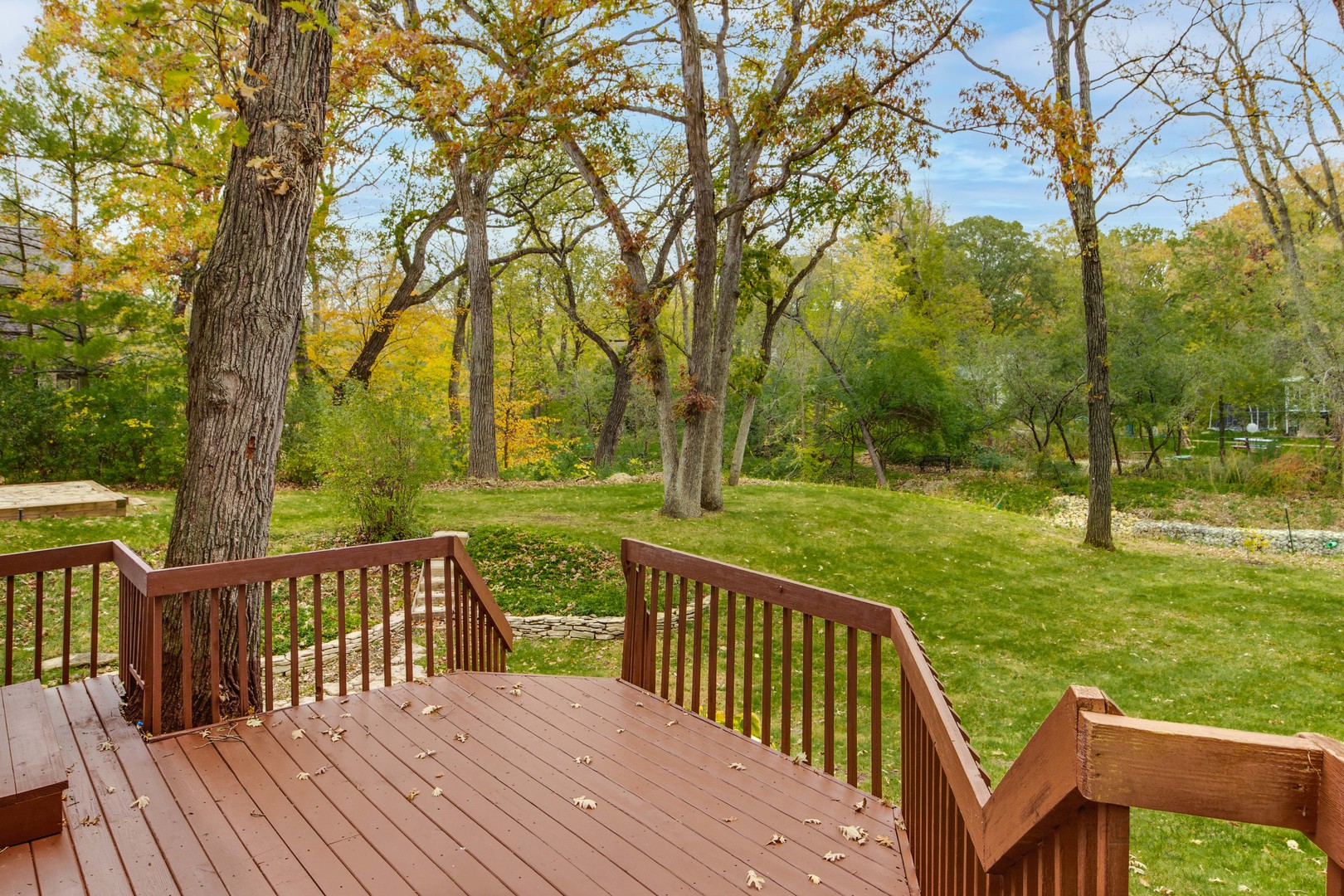 875 Valley Road Lake Forest, IL 60045 - Photo 39 of 43 a view of a wooden deck with trees