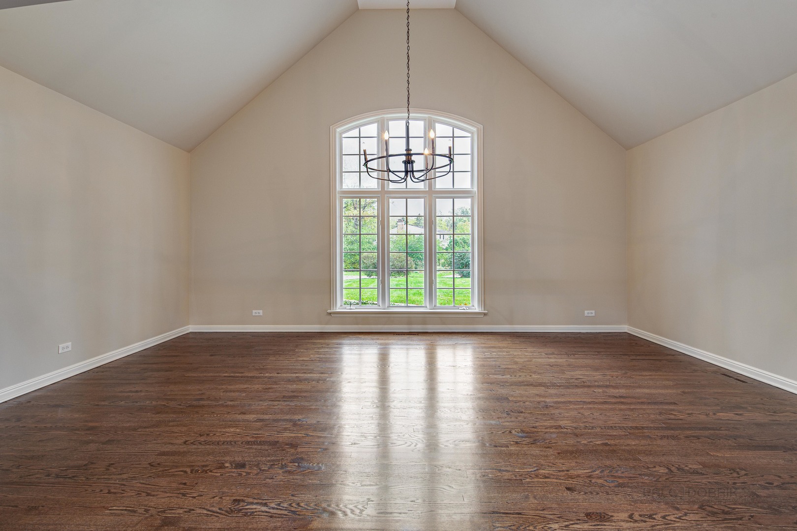 875 Valley Road Lake Forest, IL 60045 - Photo 5 of 43 a view of an empty room with wooden floor and a window