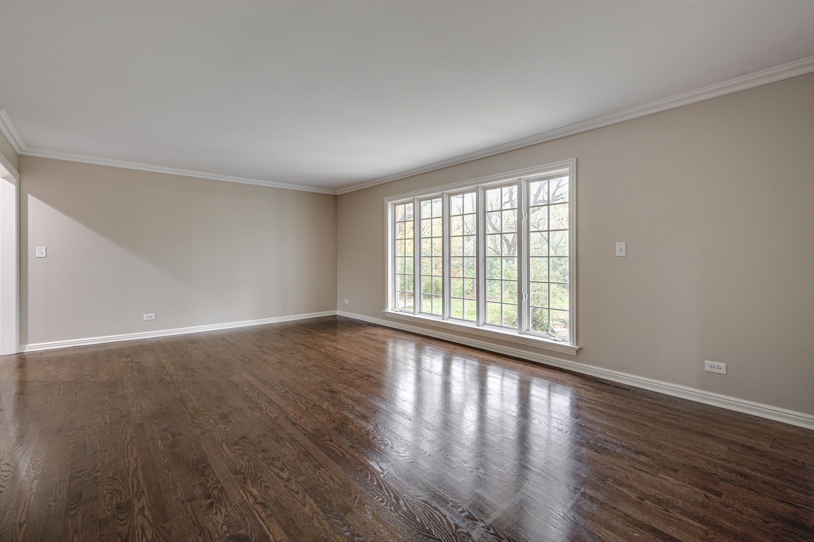 875 Valley Road Lake Forest, IL 60045 - Photo 8 of 43 a view of an empty room with wooden floor and a window