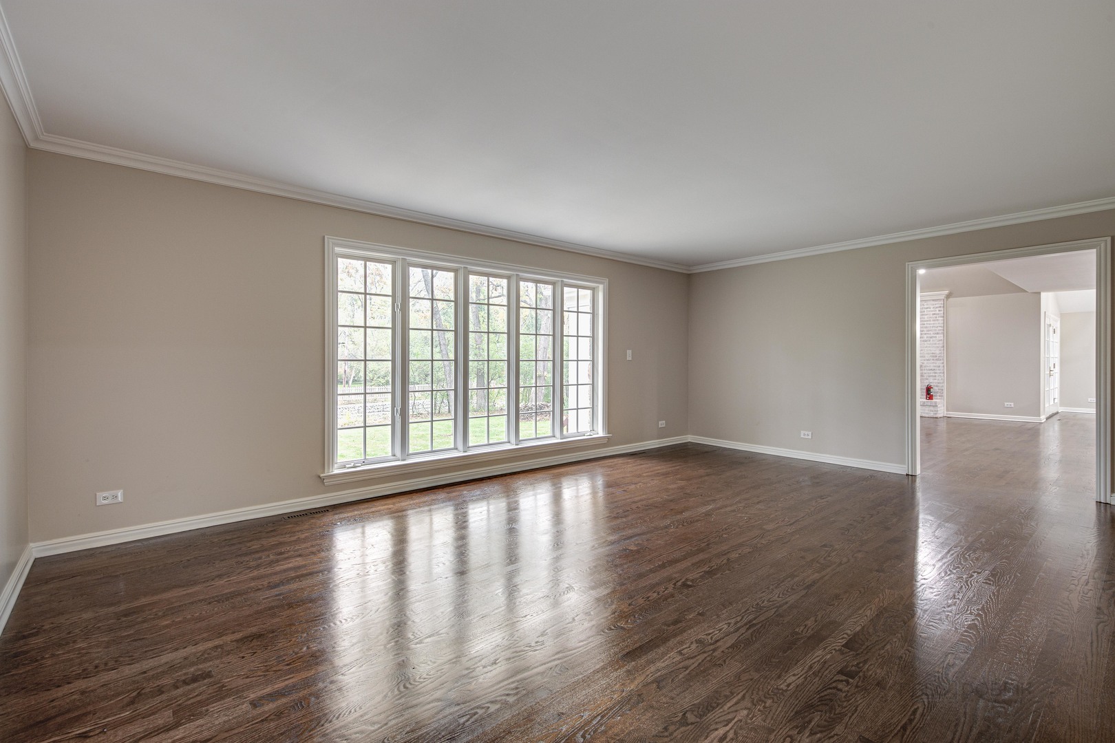 875 Valley Road Lake Forest, IL 60045 - Photo 9 of 43 a view of an empty room with wooden floor and a window