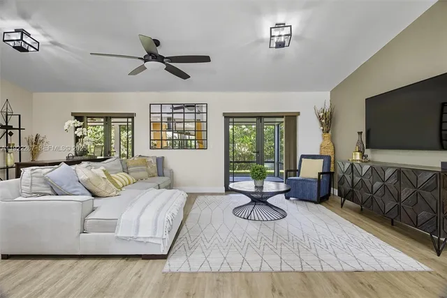 a living room with furniture and a flat screen tv