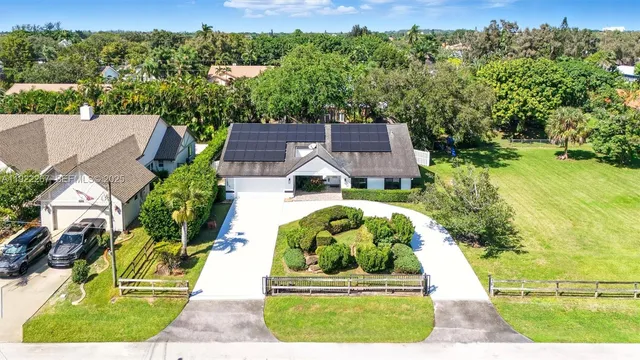 an aerial view of a house with a garden