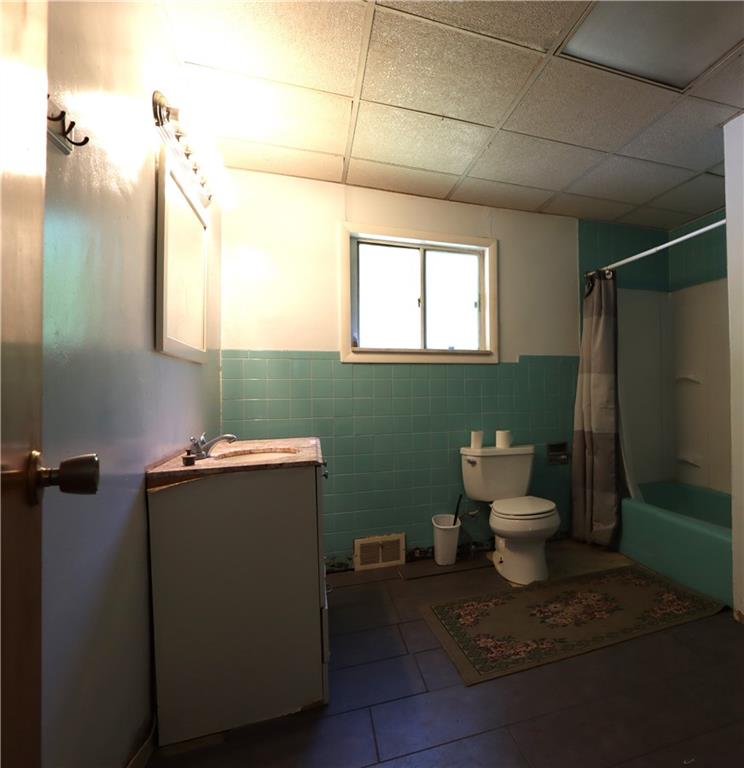 733 Crawford Run Road Tarentum, PA 15084 - Photo 8 of 18 a bathroom with a toilet sink and mirror