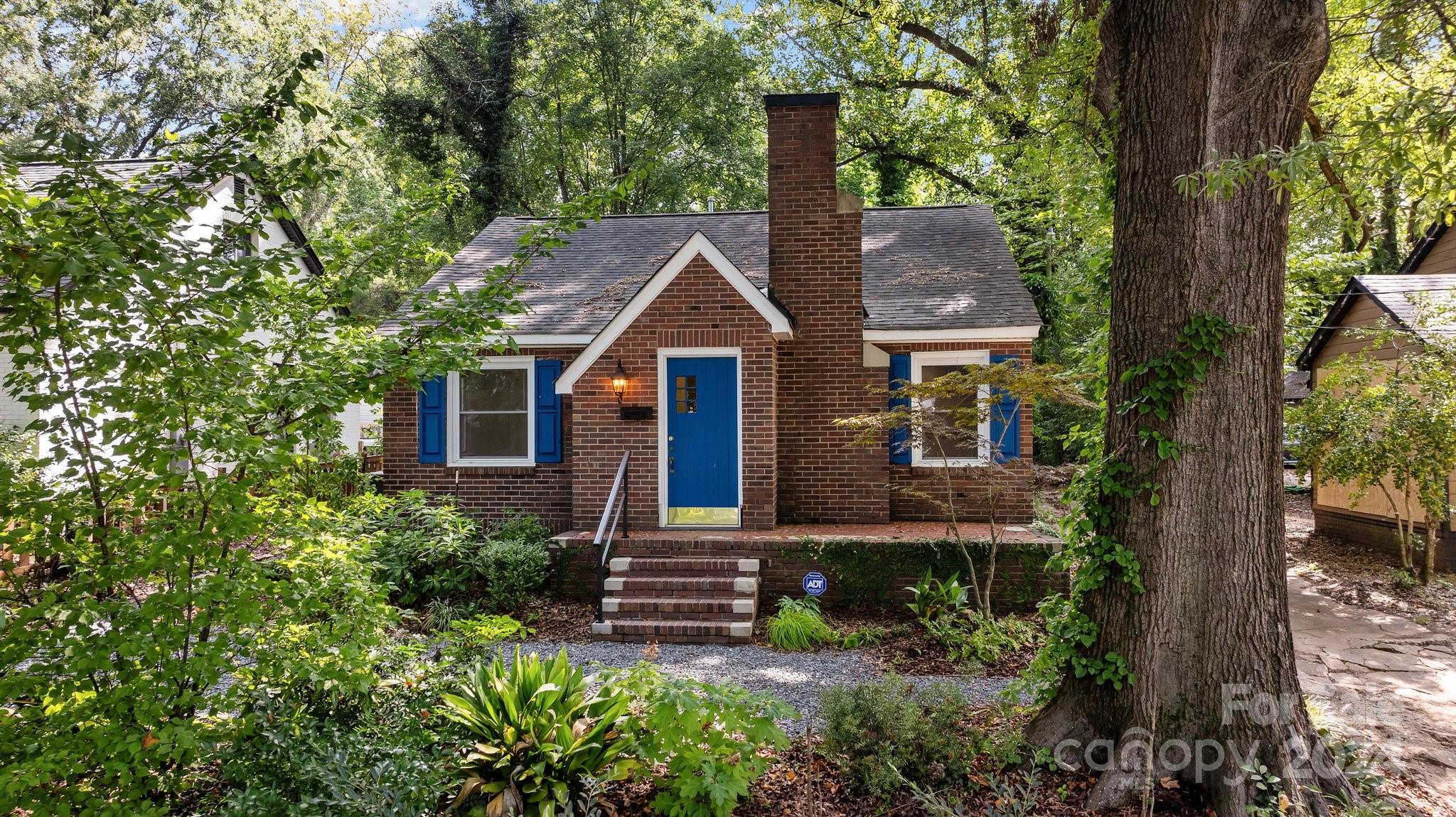 3020 Rush Avenue Charlotte, NC 28208 - Photo 1 of 31 a front view of a house with garden