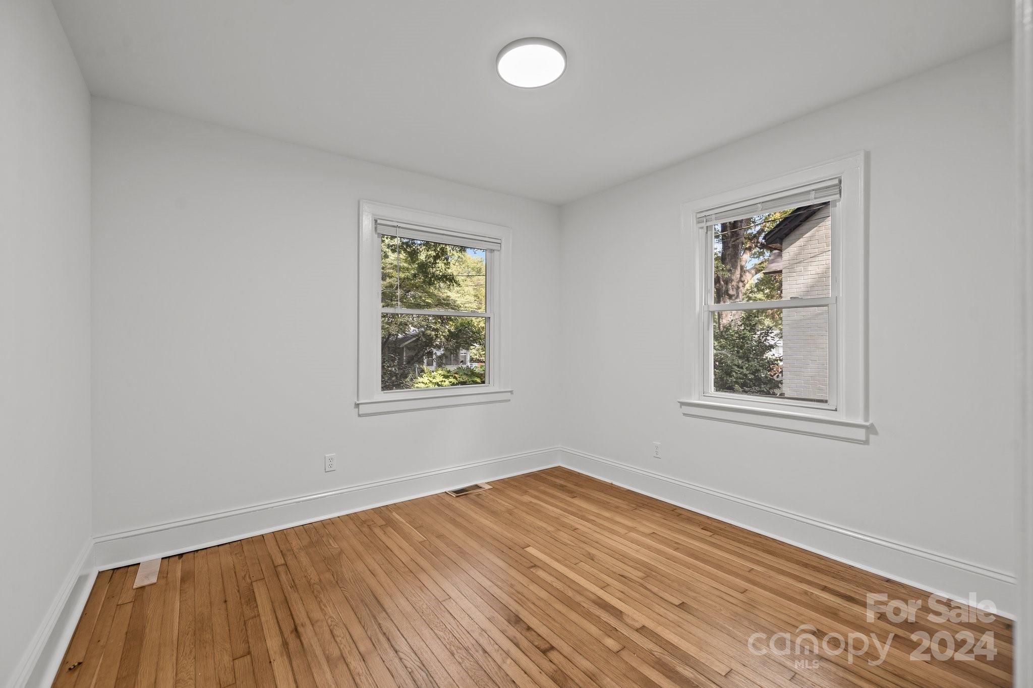 3020 Rush Avenue Charlotte, NC 28208 - Photo 11 of 31 wooden floor in an empty room with a window
