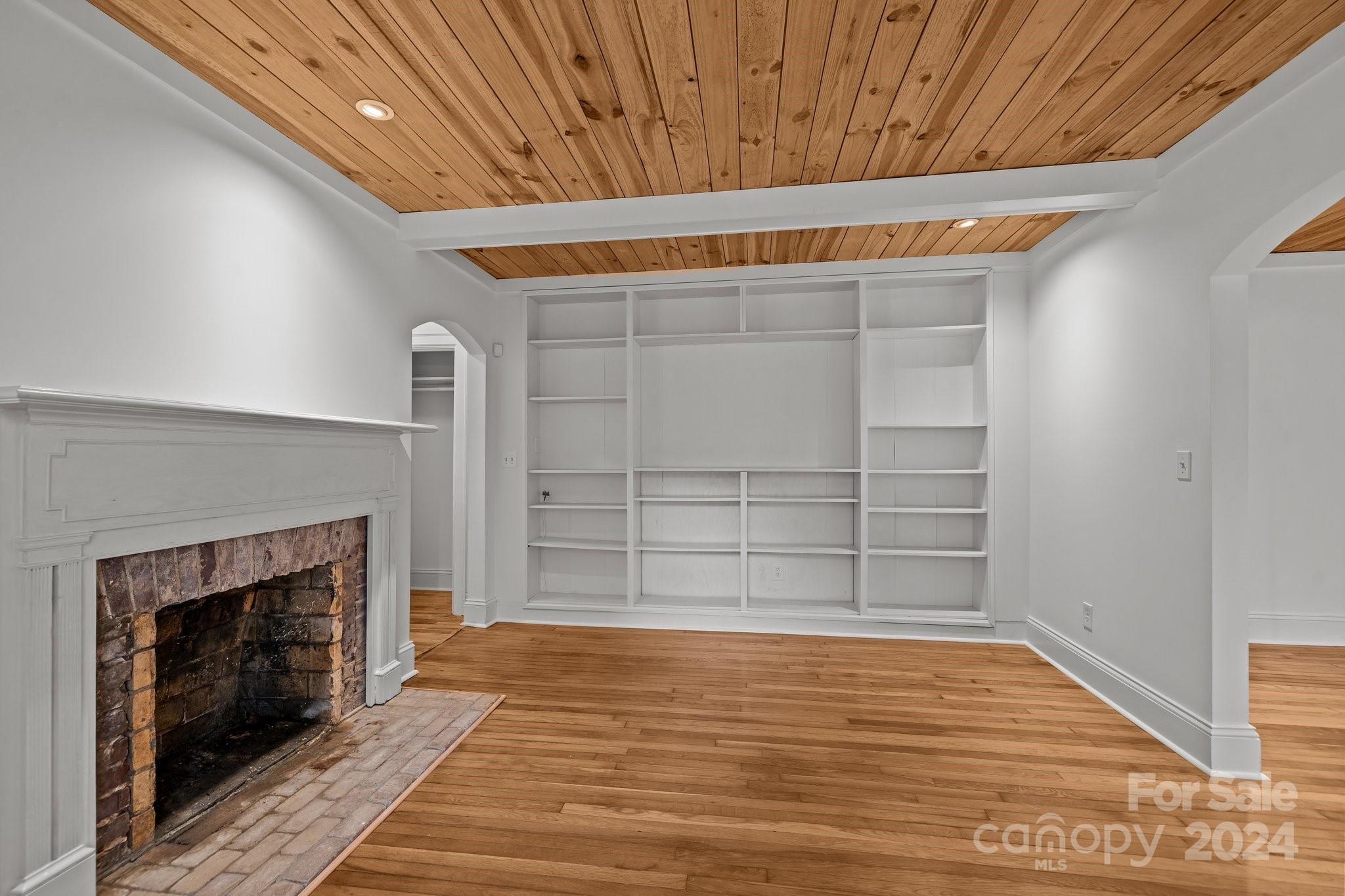 3020 Rush Avenue Charlotte, NC 28208 - Photo 20 of 31 a view of a room with wooden floor and a fireplace