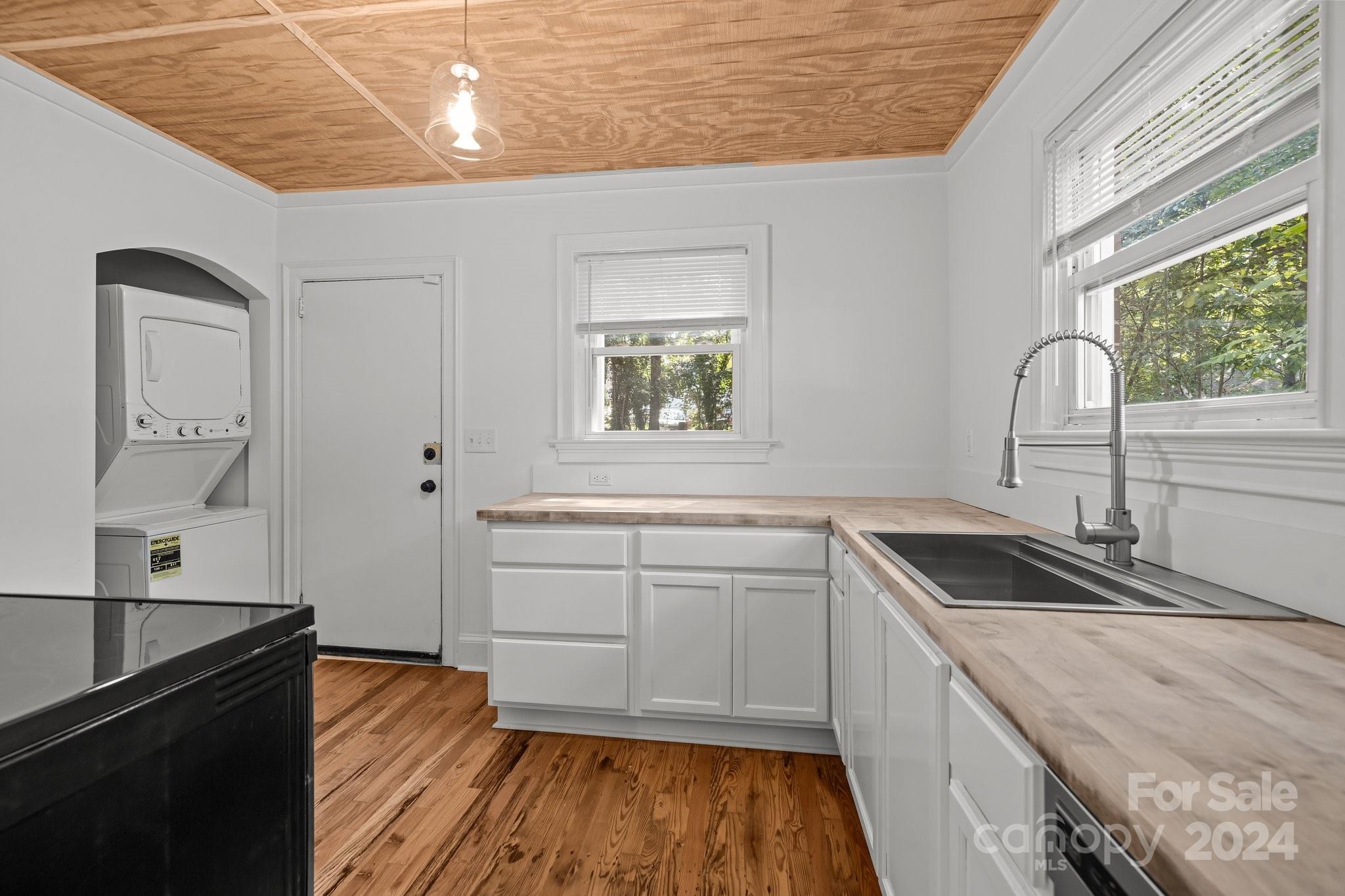 3020 Rush Avenue Charlotte, NC 28208 - Photo 4 of 31 a kitchen with a sink stove and cabinets