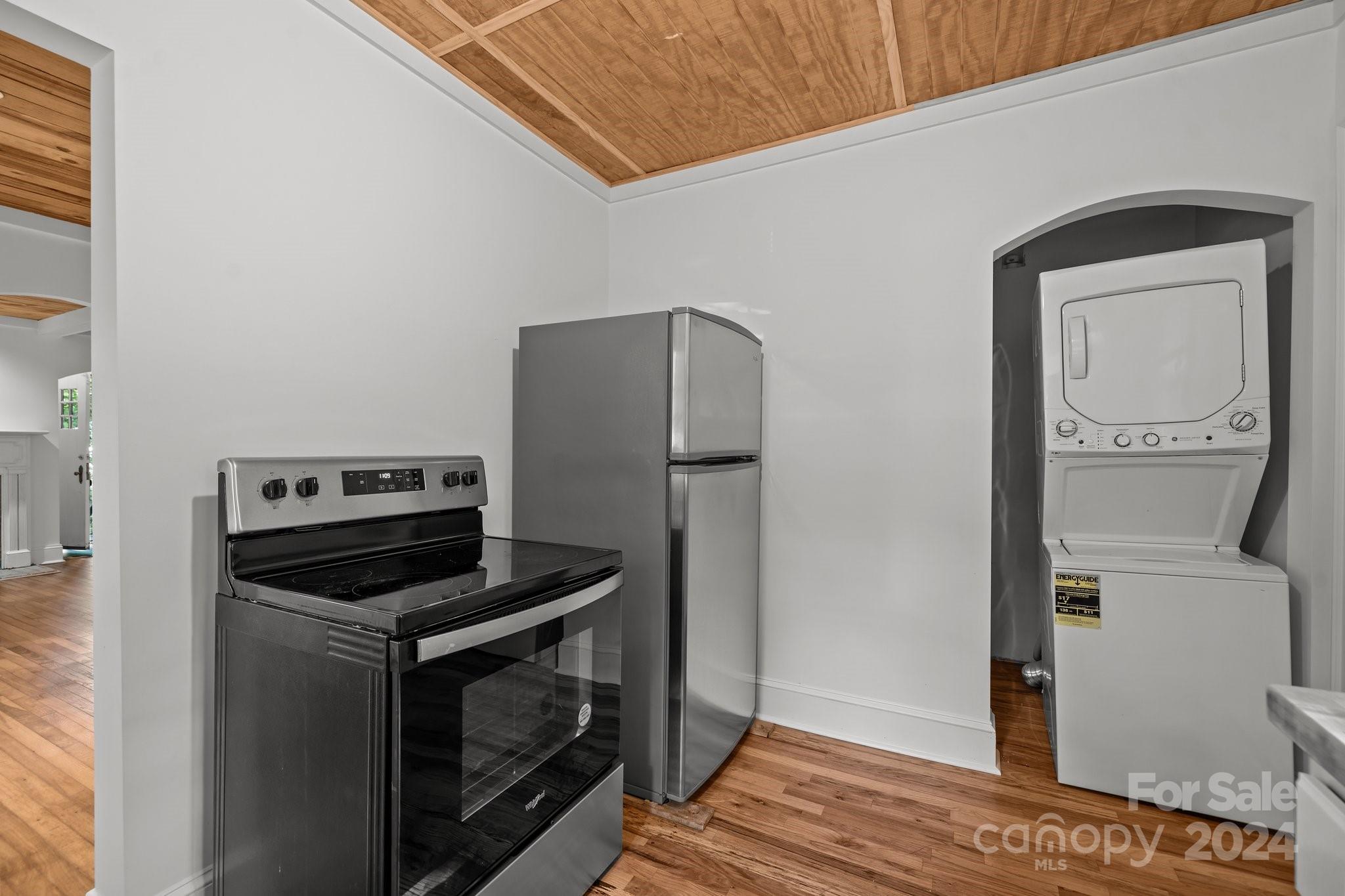 3020 Rush Avenue Charlotte, NC 28208 - Photo 7 of 31 a kitchen with a refrigerator and a stove