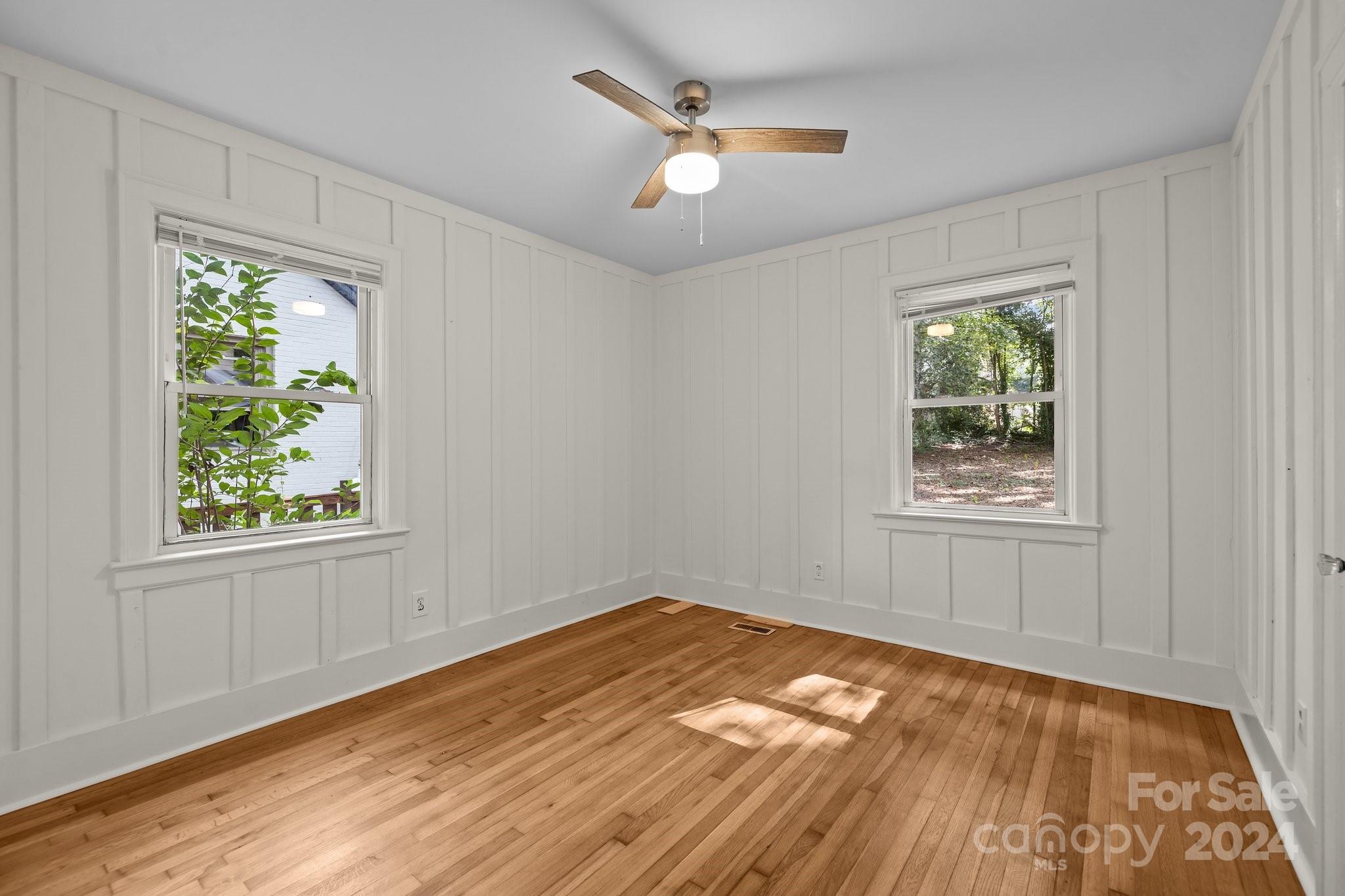 3020 Rush Avenue Charlotte, NC 28208 - Photo 8 of 31 a view of empty room with wooden floor and fan