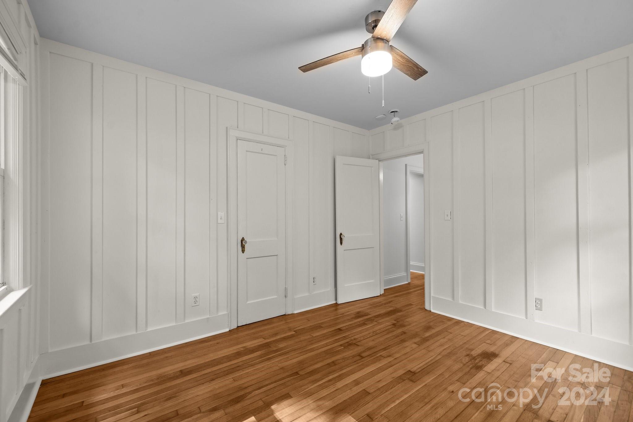 3020 Rush Avenue Charlotte, NC 28208 - Photo 9 of 31 a view of empty room with wooden floor and ceiling fan