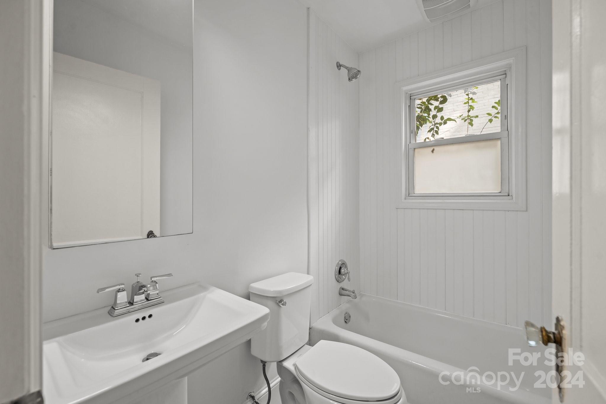 3020 Rush Avenue Charlotte, NC 28208 - Photo 10 of 31 a bathroom with a sink toilet and shower