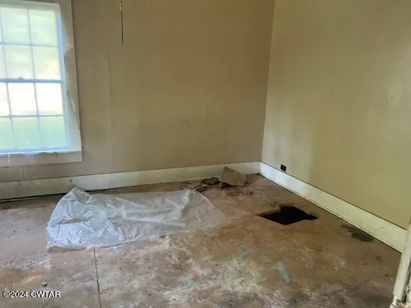 a view of a bedroom with a bed