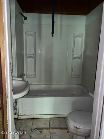 a bathroom with a toilet and a sink