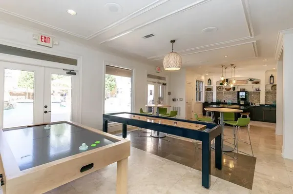 a kitchen with counter top space appliances and a window