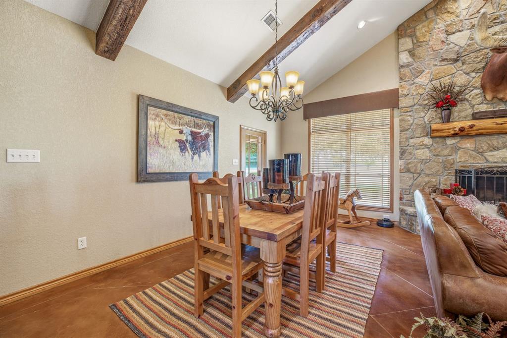 2548 Fm 1496 Dublin, TX 76446 - Photo 11 of 40 a view of a dining room with furniture a chandelier and wooden floor