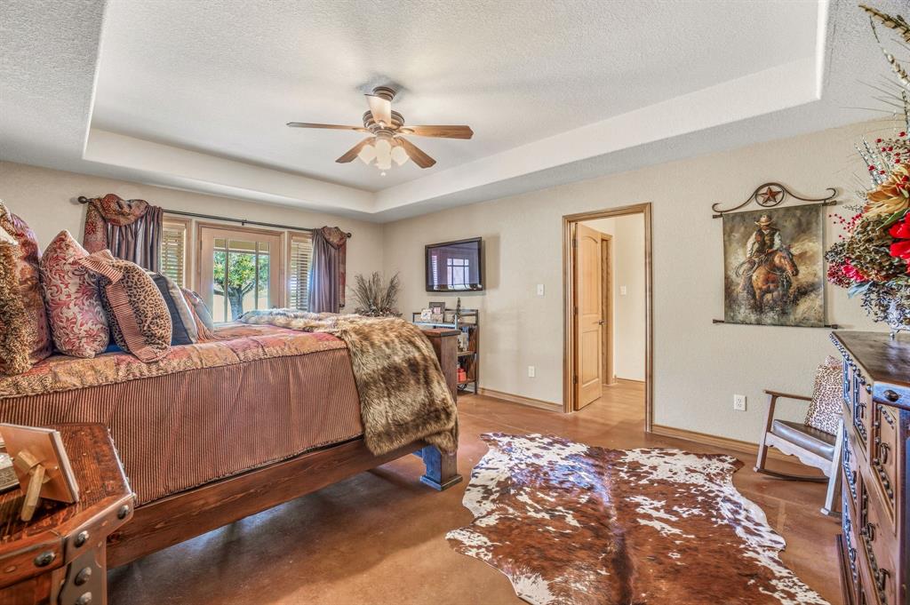 2548 Fm 1496 Dublin, TX 76446 - Photo 12 of 40 a bed room with a bed and a chandelier